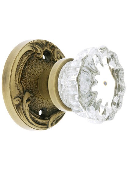 Lafayette Rosette Door Set With Fluted Crystal Knobs in Antique Brass.